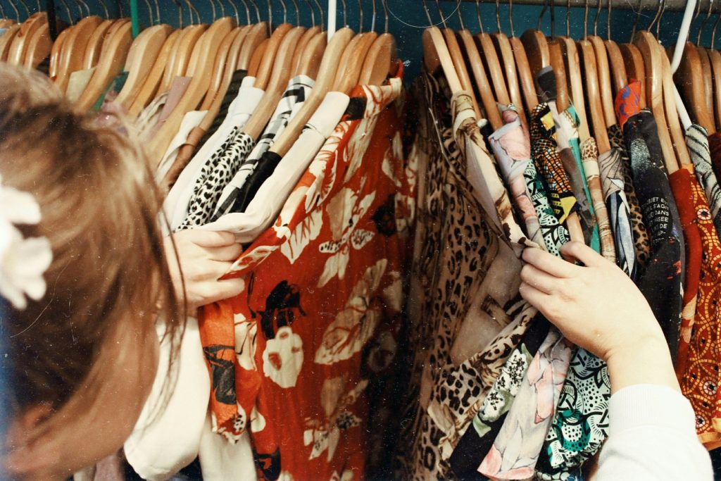 clothe rack with second-hand colourful pieces